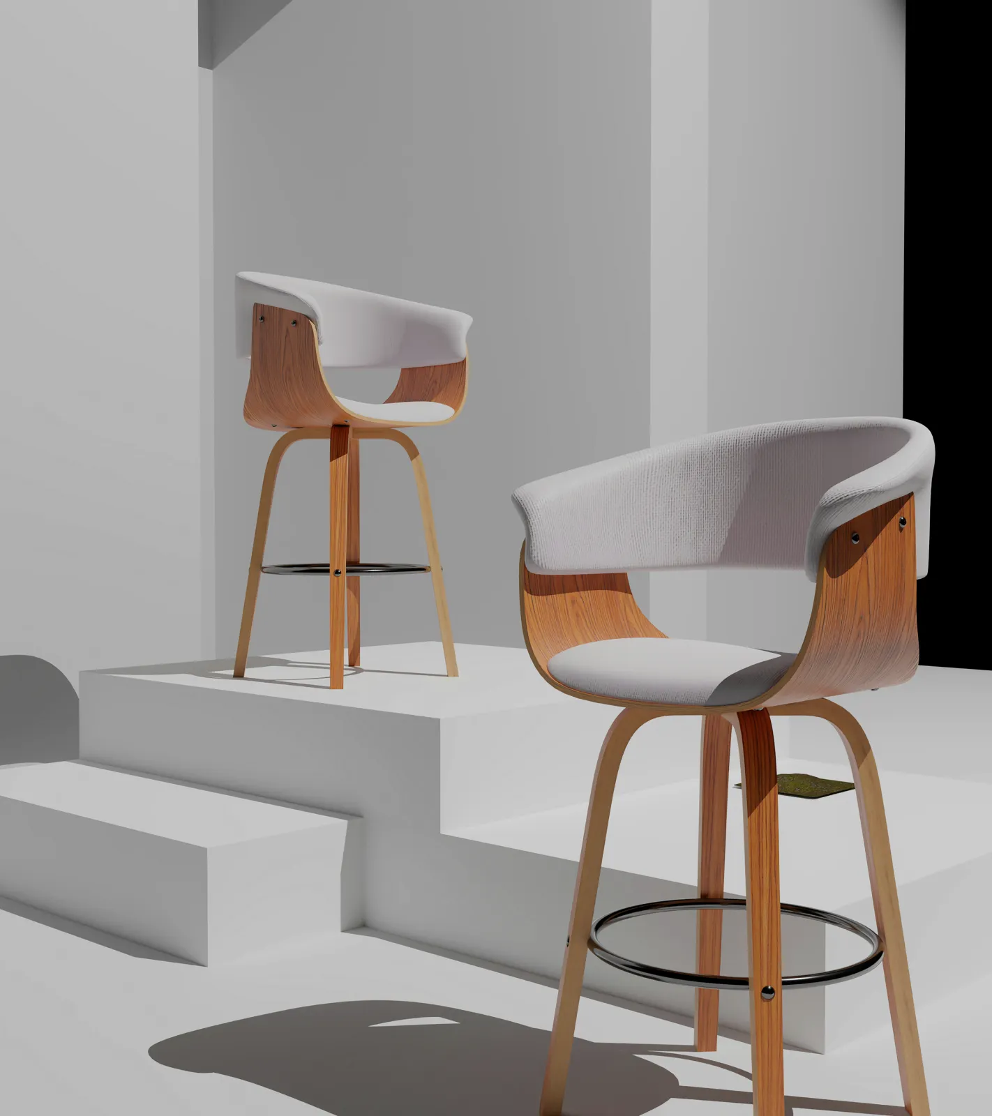Two wood and pale-fabric stools in a white room